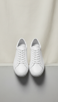 Minimalist white sneakers with cushioned sole